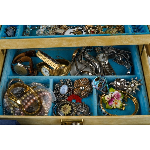 611 - A collection of costume jewellery in two jewellery boxes and a bag, including bead necklaces, a hear... 