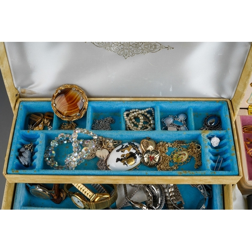 611 - A collection of costume jewellery in two jewellery boxes and a bag, including bead necklaces, a hear... 