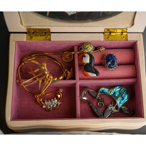 611 - A collection of costume jewellery in two jewellery boxes and a bag, including bead necklaces, a hear... 