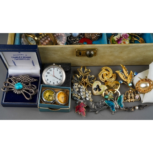 611 - A collection of costume jewellery in two jewellery boxes and a bag, including bead necklaces, a hear... 