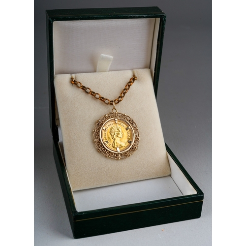 616 - A 1982 half sovereign mounted within a 9ct gold filigree pendant mount with four illusion set white ... 