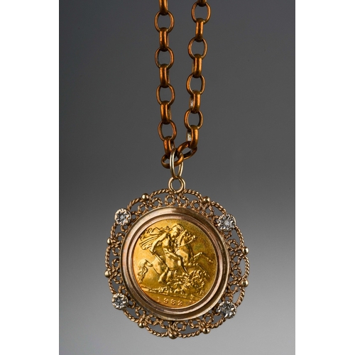 616 - A 1982 half sovereign mounted within a 9ct gold filigree pendant mount with four illusion set white ... 