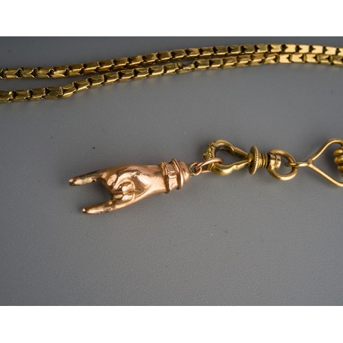 625 - A long unmarked yellow metal chain ( tests as 18ct gold) with slider and charms, the fancy box link ... 