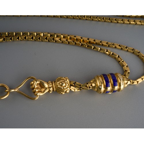 625 - A long unmarked yellow metal chain ( tests as 18ct gold) with slider and charms, the fancy box link ... 