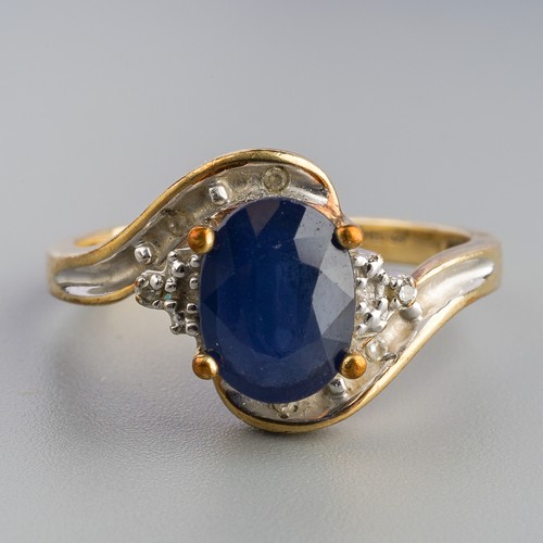 629 - A 9ct gold sapphire and diamond ring and a 9ct gold sapphire bracelet. The ring set with an oval sha... 