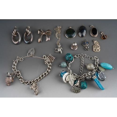 643 - Collection of silver and white metal jewellery to include charm bracelets, agate pendants, brooch, r... 