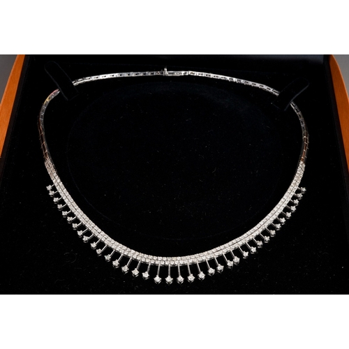 650 - A white and gold diamond fringe necklace, stamped 14k. The front designed as a series of approx thir... 