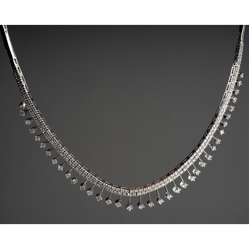 650 - A white and gold diamond fringe necklace, stamped 14k. The front designed as a series of approx thir... 