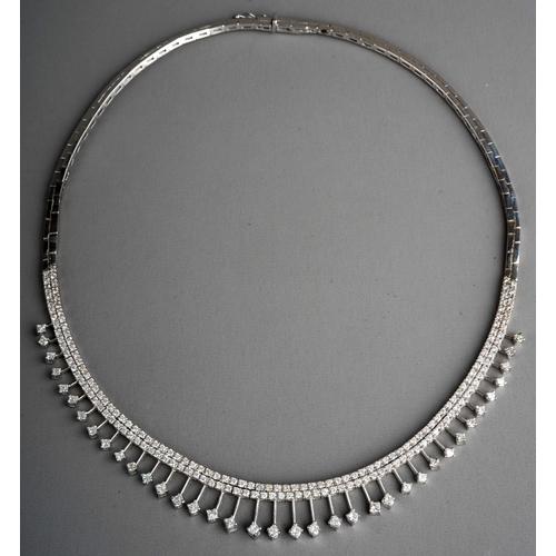 650 - A white and gold diamond fringe necklace, stamped 14k. The front designed as a series of approx thir... 