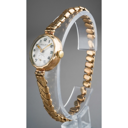 655 - 9 ct gold cased ladies watch