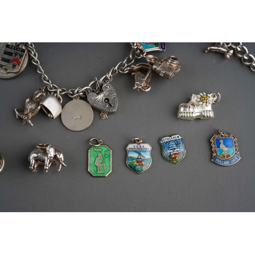 658 - Collection of silver charms on 3 bracelet with enamelled and various other charms. Gross weight 201g