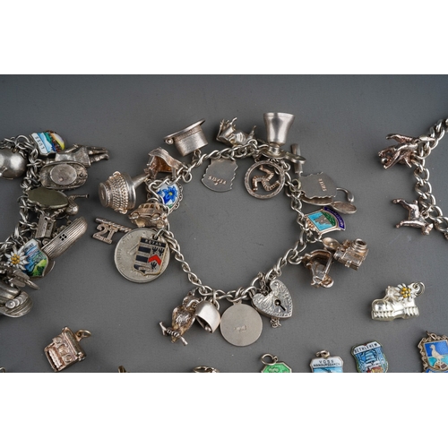 658 - Collection of silver charms on 3 bracelet with enamelled and various other charms. Gross weight 201g