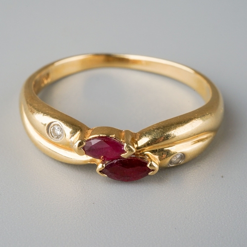 664 - A ruby and diamond dress ring. Set with two marquise shape rubies and two round brilliant cut diamon... 