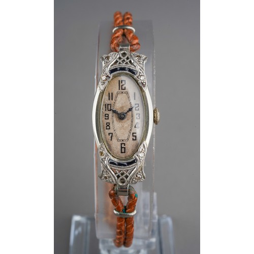 674 - An early 20th century sapphire and diamond cocktail watch, cased. The cream dial within a white meta... 