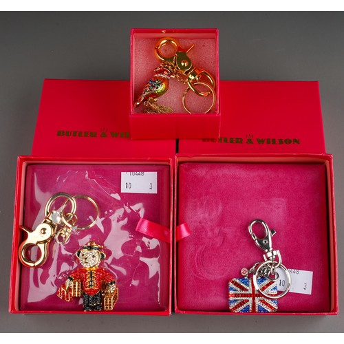 682 - Costume: three Butler & Wilson boxed key rings to include: Union Jack, Porter Teddy and Kingfisher w... 