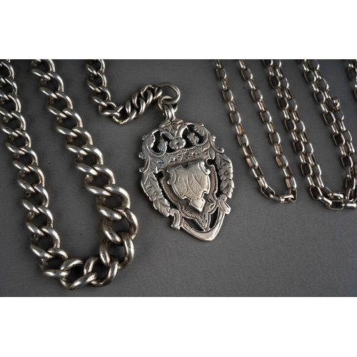 690 - A late Victorian silver medallion on a graduated link watch chain, missing clasp, length 37cm, toget... 