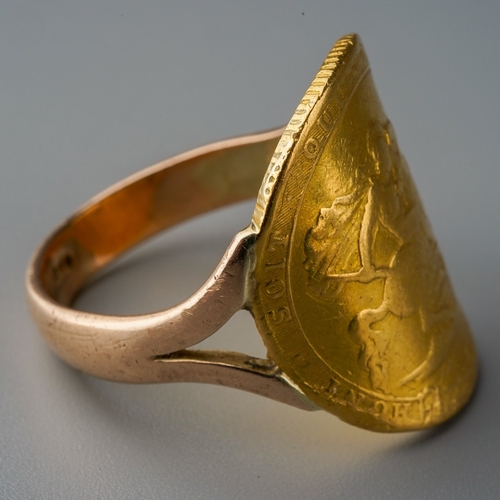 700 - Coin ring - George III (1760 - 1820) A gold full sovereign coin, 1817 on a 9 ct gold band, gross wei... 