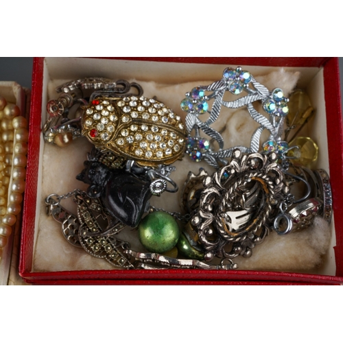 712 - A group lot of assorted costume jewellery, 1935 Crown, marcasite jewellery, Australia wishbone brooc... 