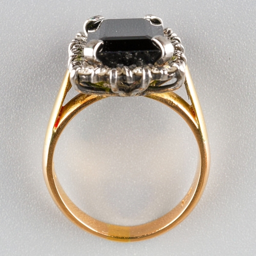 716 - A tourmaline and diamond cluster ring. Set with a rectangular tourmaline, measuring approx 13.31 - 8... 