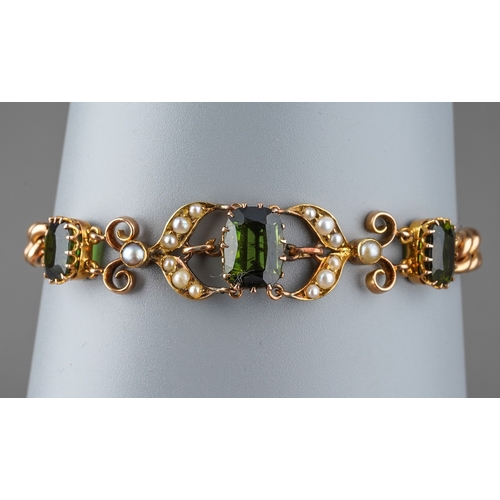 722 - An early 20th century gem set bracelet. The front designed as a series of three graduating cushion-s... 