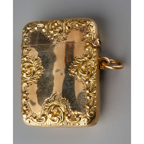 726 - A late Victorian 9ct gold vesta case, the borders chased with waisted band of flowers, central initi... 