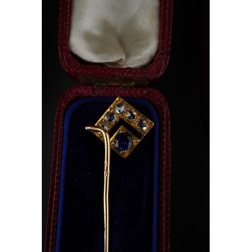 733 - A collection of four stickpin. To include a cultured pearl and pink cabochon floral stickpin, a synt... 