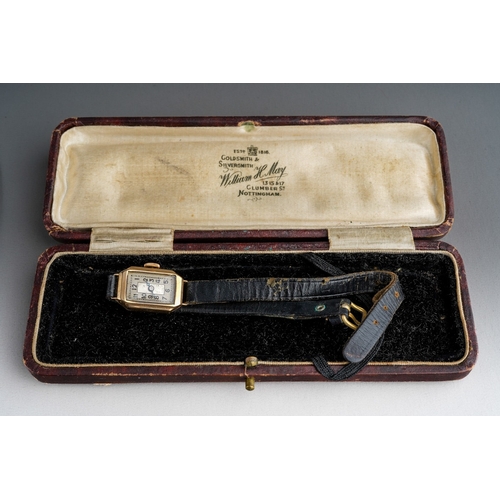 751 - A ladies 1930s 9ct gold wristwatch. The cream coloured dial with black Arabic numerals, blue steel h... 