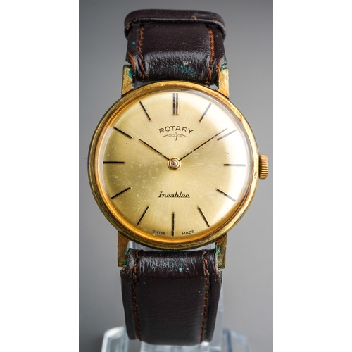 752 - A mid 20th century Rotary wristwatch. The champaign coloured dial, with black enamel hourly applied ... 