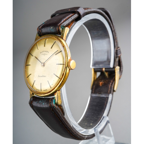 752 - A mid 20th century Rotary wristwatch. The champaign coloured dial, with black enamel hourly applied ... 