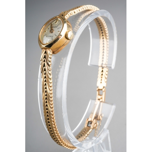 755 - 9ct Gold Acurist Ladies wrist watch with 9 ct gold strap, gross weight 17.3g