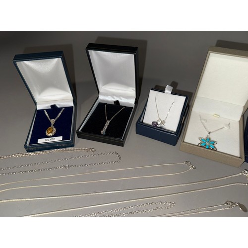 761 - A collection of white metal (marked 925) and sterling silver chains and pendant to include one set w... 