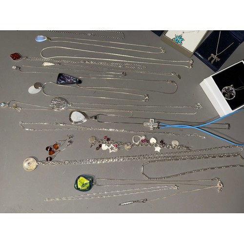 761 - A collection of white metal (marked 925) and sterling silver chains and pendant to include one set w... 