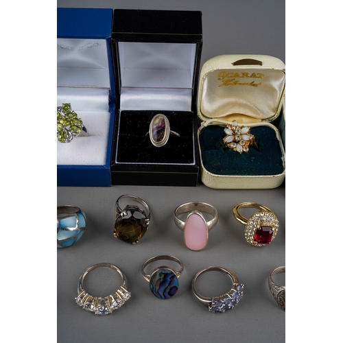 767 - Collection of silver, white metal and dress rings. Some set with various semi precious stones (q)