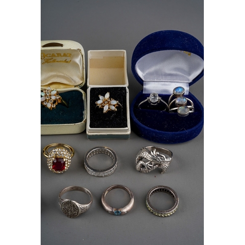 767 - Collection of silver, white metal and dress rings. Some set with various semi precious stones (q)