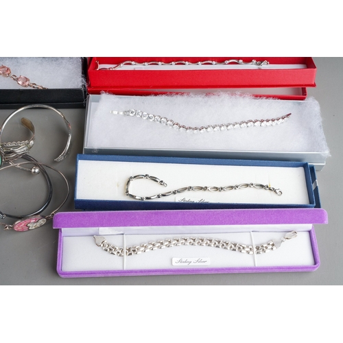 769 - Large collection of various silver bangles and bracelets to include gem set, Aurora Moon, British ha... 