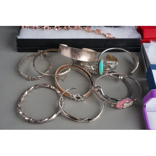 769 - Large collection of various silver bangles and bracelets to include gem set, Aurora Moon, British ha... 