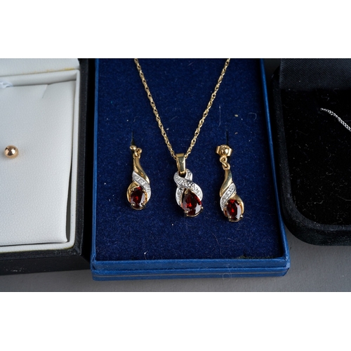 774 - 9 ct gem set pendant and earrings by Elizabeth Duke, 9 ct white gold chain and cross set with a diam... 