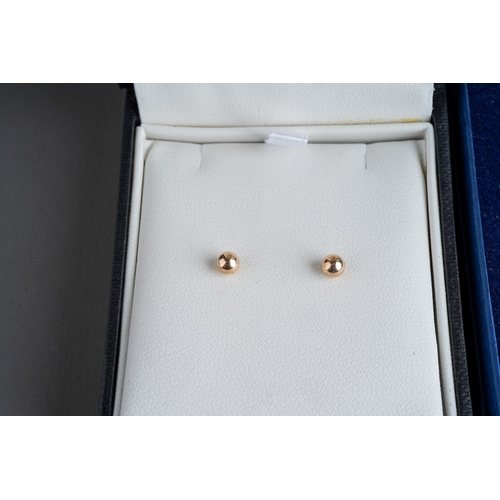 774 - 9 ct gem set pendant and earrings by Elizabeth Duke, 9 ct white gold chain and cross set with a diam... 