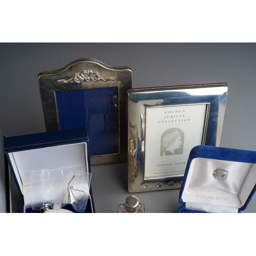 793 - A collection of silver including photograph frames, Florence Nightingale dish, plain scent bottle (b... 