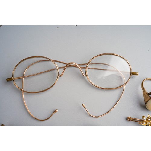 799 - Yellow metal (test as 9k gold) spectacles, 9k gold scarf pin, yellow metal and seed pearl brooch, 9k... 