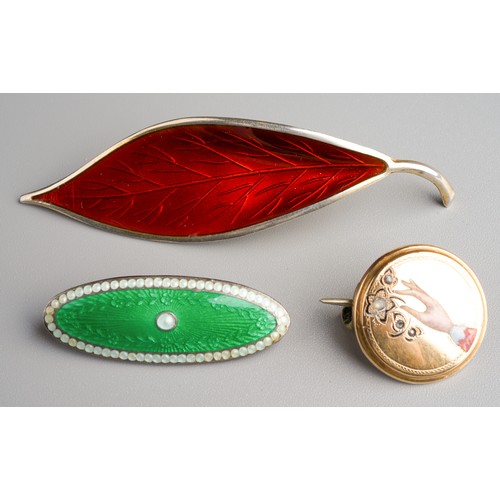 801 - David Andersen, Norway sterling silver and red enamel leaf brooch together with green and white enam... 