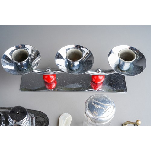 805 - An Art Deco chrome novelty condiment set, the Ship shaped body with detachable funnel shaped salt an... 