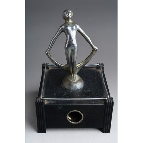 809 - A Dunhill US Pat No 2020142 Silent Flame table lighter, in the form of nude female on bakelite stand... 