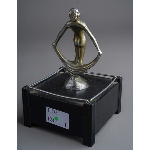 809 - A Dunhill US Pat No 2020142 Silent Flame table lighter, in the form of nude female on bakelite stand... 