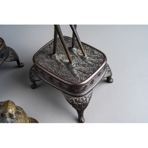 817 - A pair of early 20th Century Asian bronze figures of Cranes on stands and a Chinese bronze cast figu... 