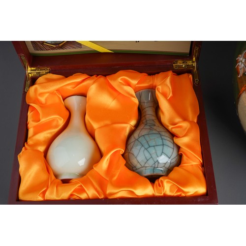 819 - A boxed set of two Chinese Modern porcelain vases together with a pair of Cloisonne vases; a Cloison... 