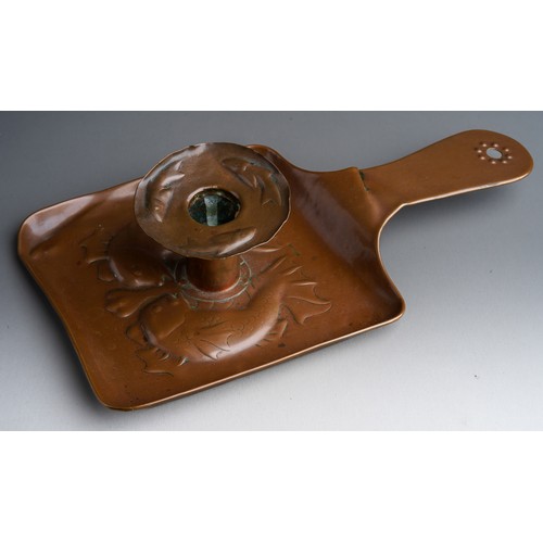 822 - A Newlyn copper chamberstick, the body and drip pan embossed with fish, stamped (the drip pan is det... 