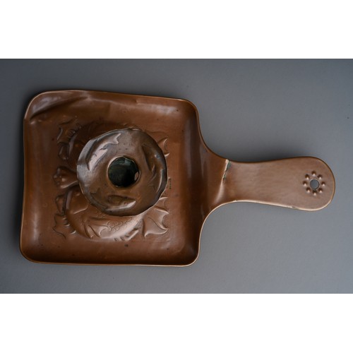 822 - A Newlyn copper chamberstick, the body and drip pan embossed with fish, stamped (the drip pan is det... 