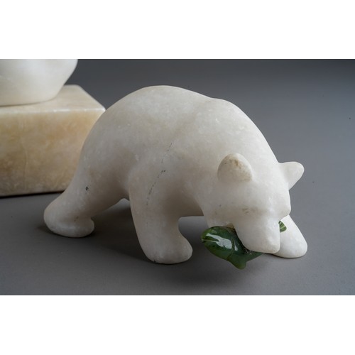 827 - A quartz model of polar bear with green glass fish together with a pair of carved marble swans (3)