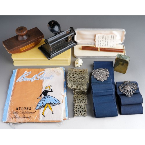 830 - Assorted items to include Red wood Pen, stockings, 3 nurses belts, desk items and a blotter made fro... 